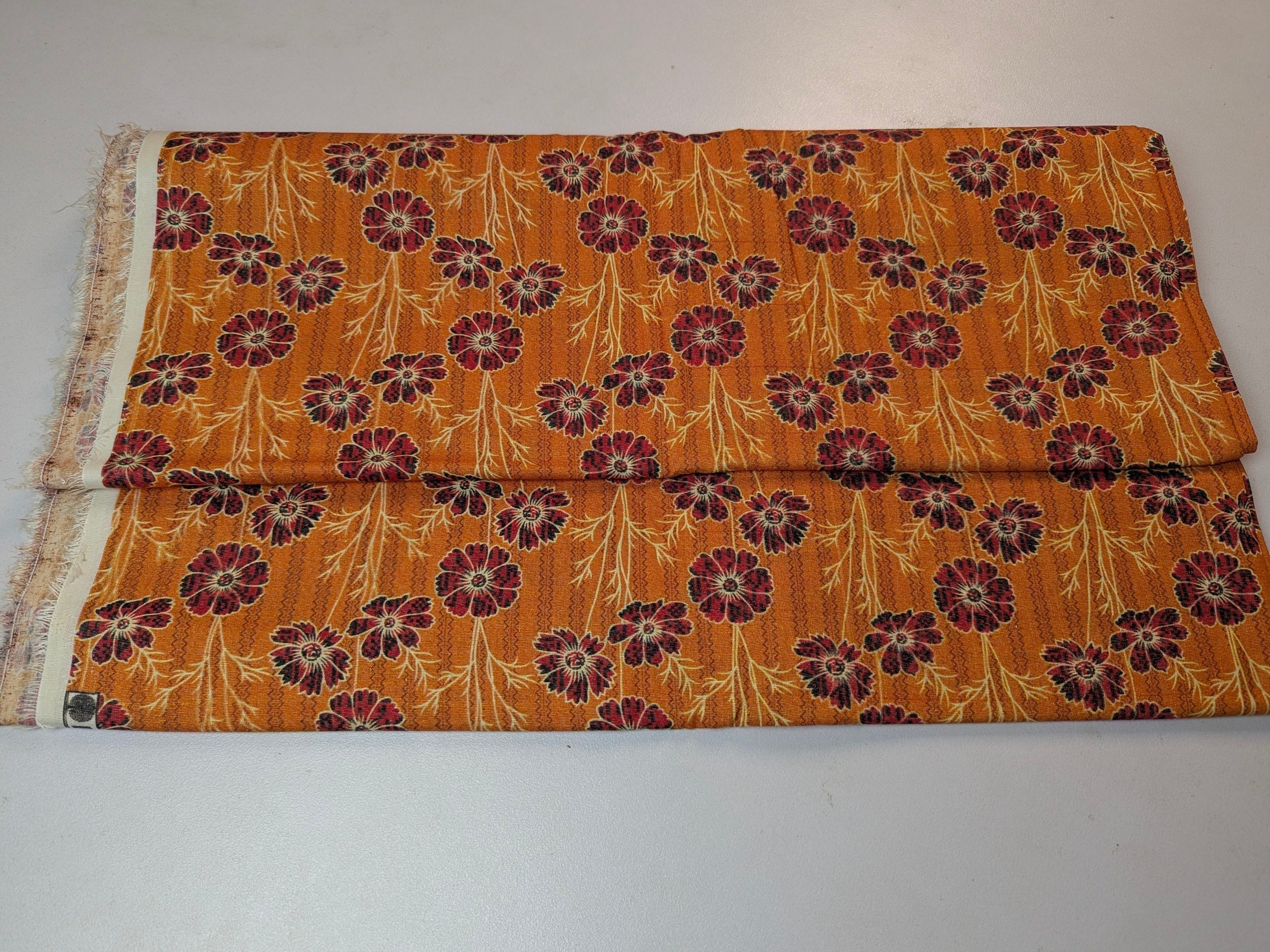 Folded fabric with floral pattern on a white background