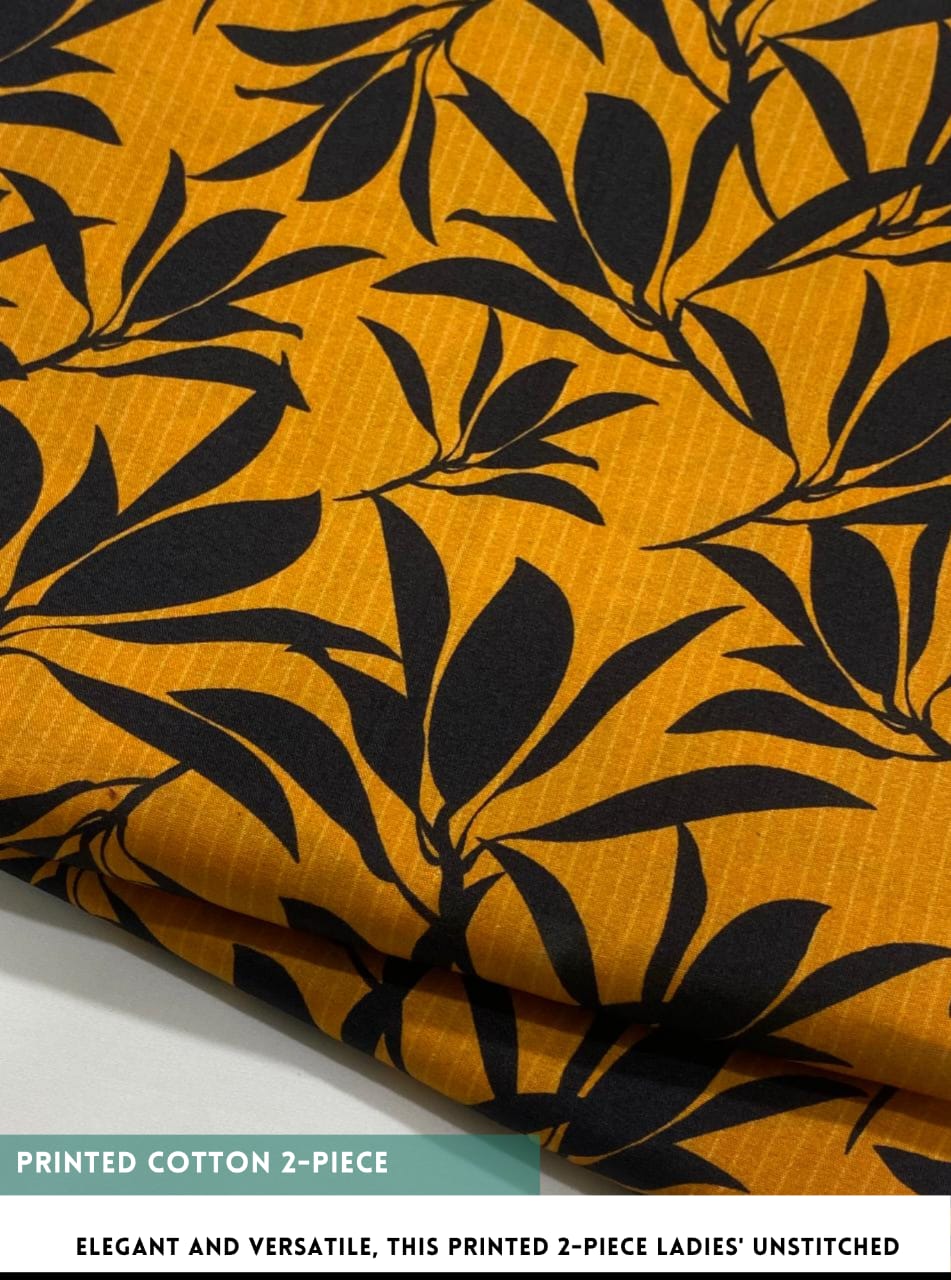 Printed cotton fabric with black leaf pattern on a yellow background