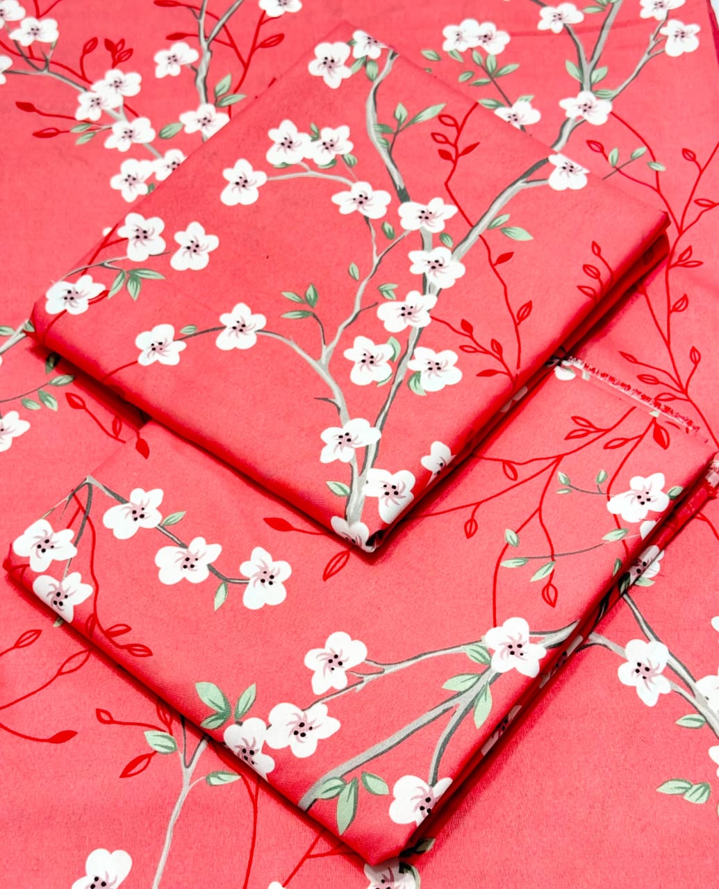 Red fabric with white floral pattern