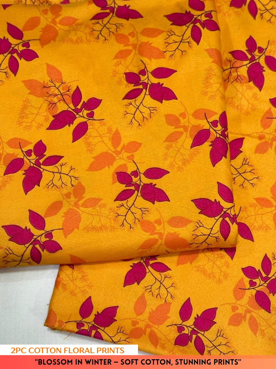 Yellow fabric with pink floral pattern on a white background