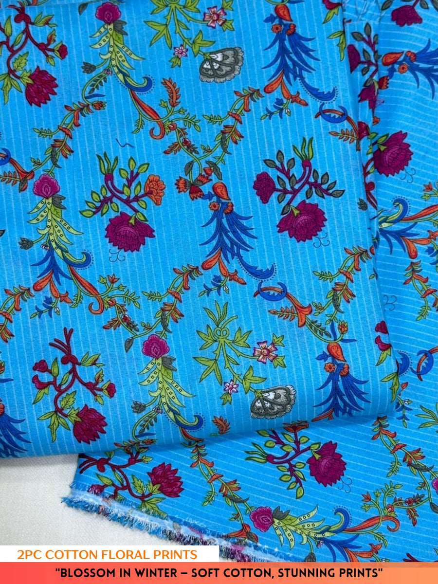 Blue floral patterned fabric with colorful flowers and leaves on a white background.