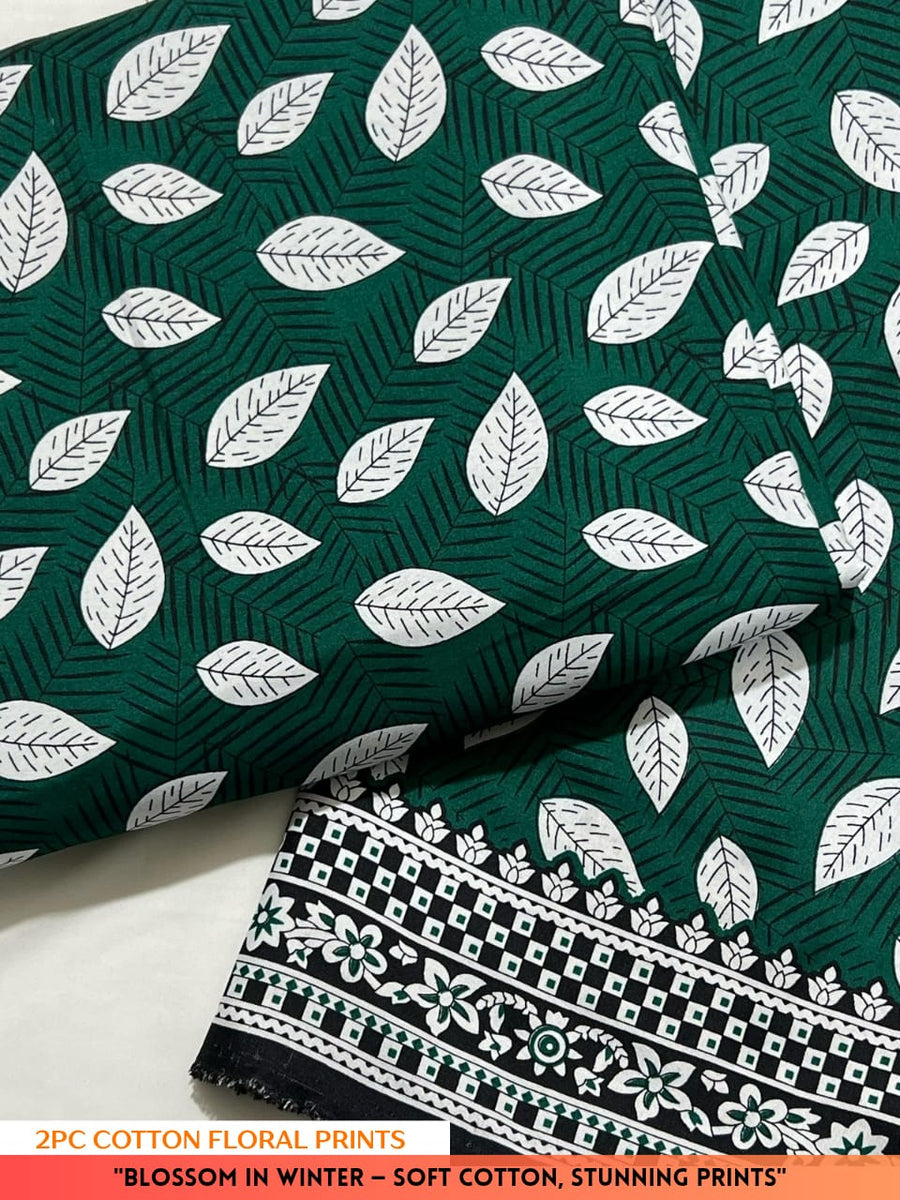 Green fabric with white leaf pattern and black and white border on a white background
