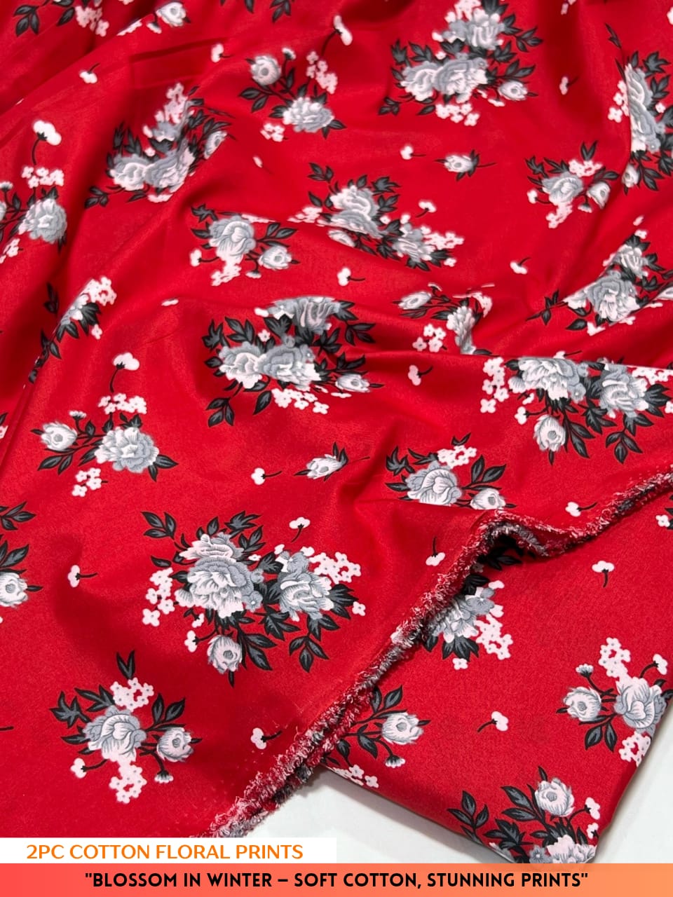 Red fabric with floral pattern on a white background