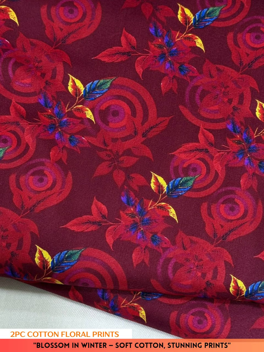 Red floral fabric with colorful leaves on a red background