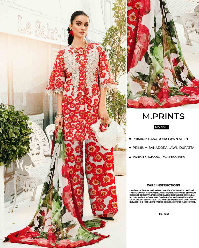 Woman wearing a red floral outfit with matching dupatta in an outdoor setting.