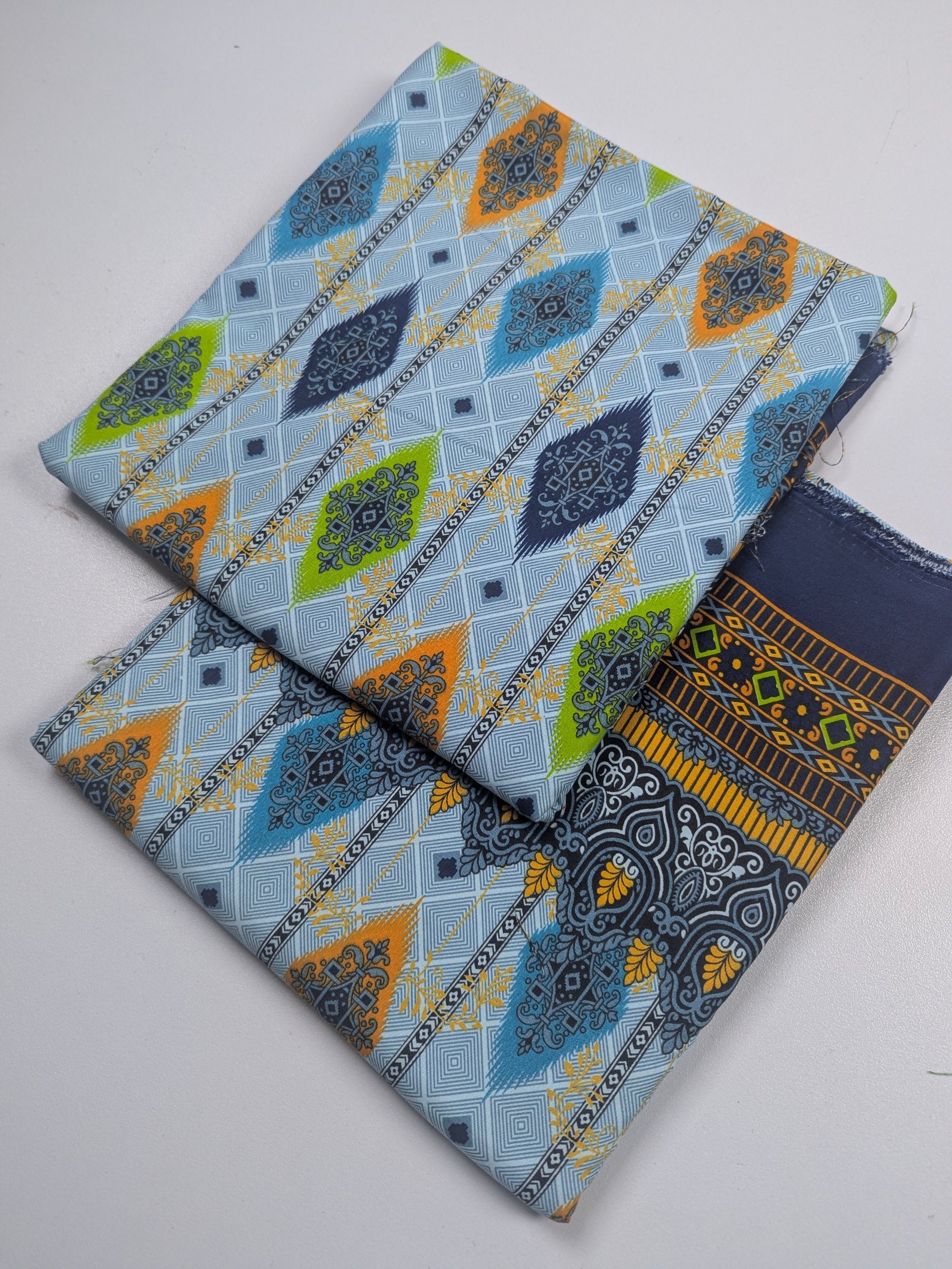 Three patterned fabric swatches on a white background