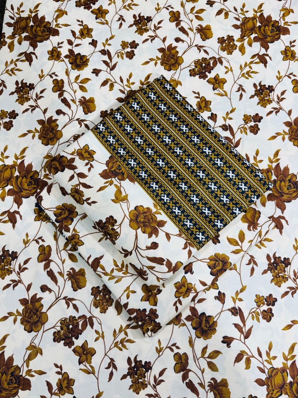 Floral fabric with a patterned strip in the center