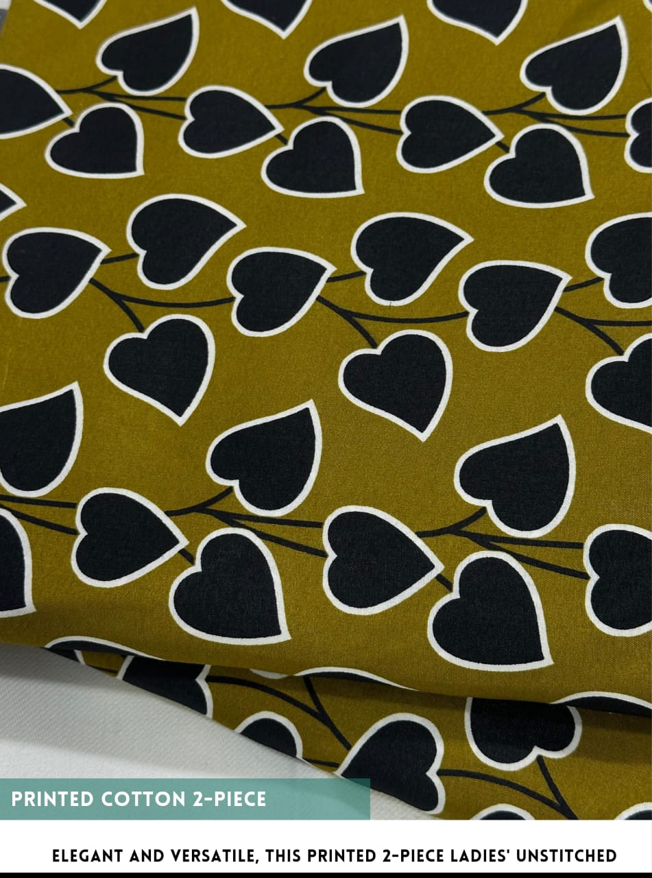 Fabric with black heart pattern on a green background