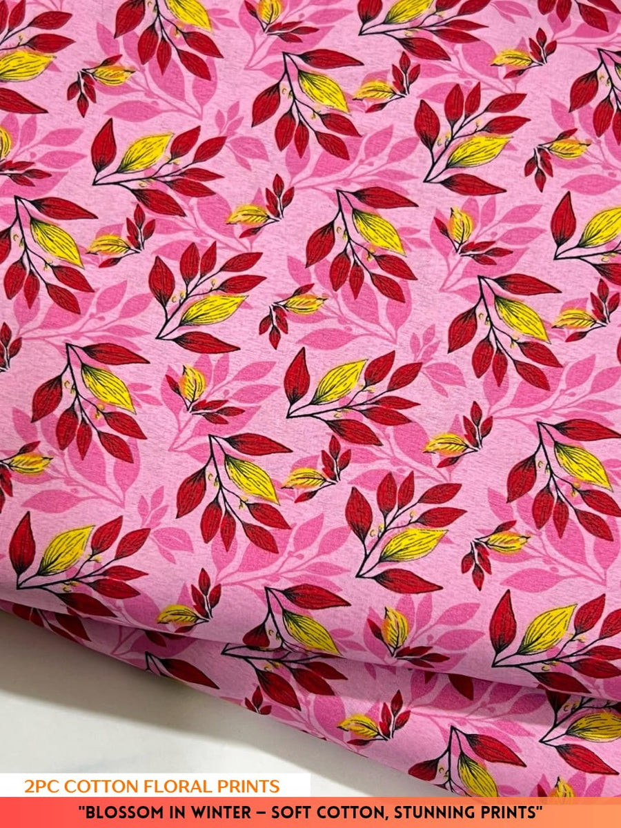 Pink fabric with red and yellow floral pattern on a white background