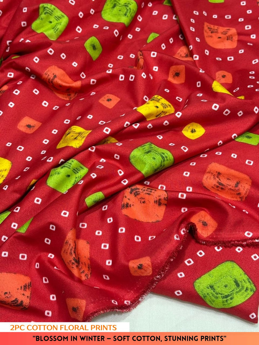 Red fabric with colorful floral prints on a white background