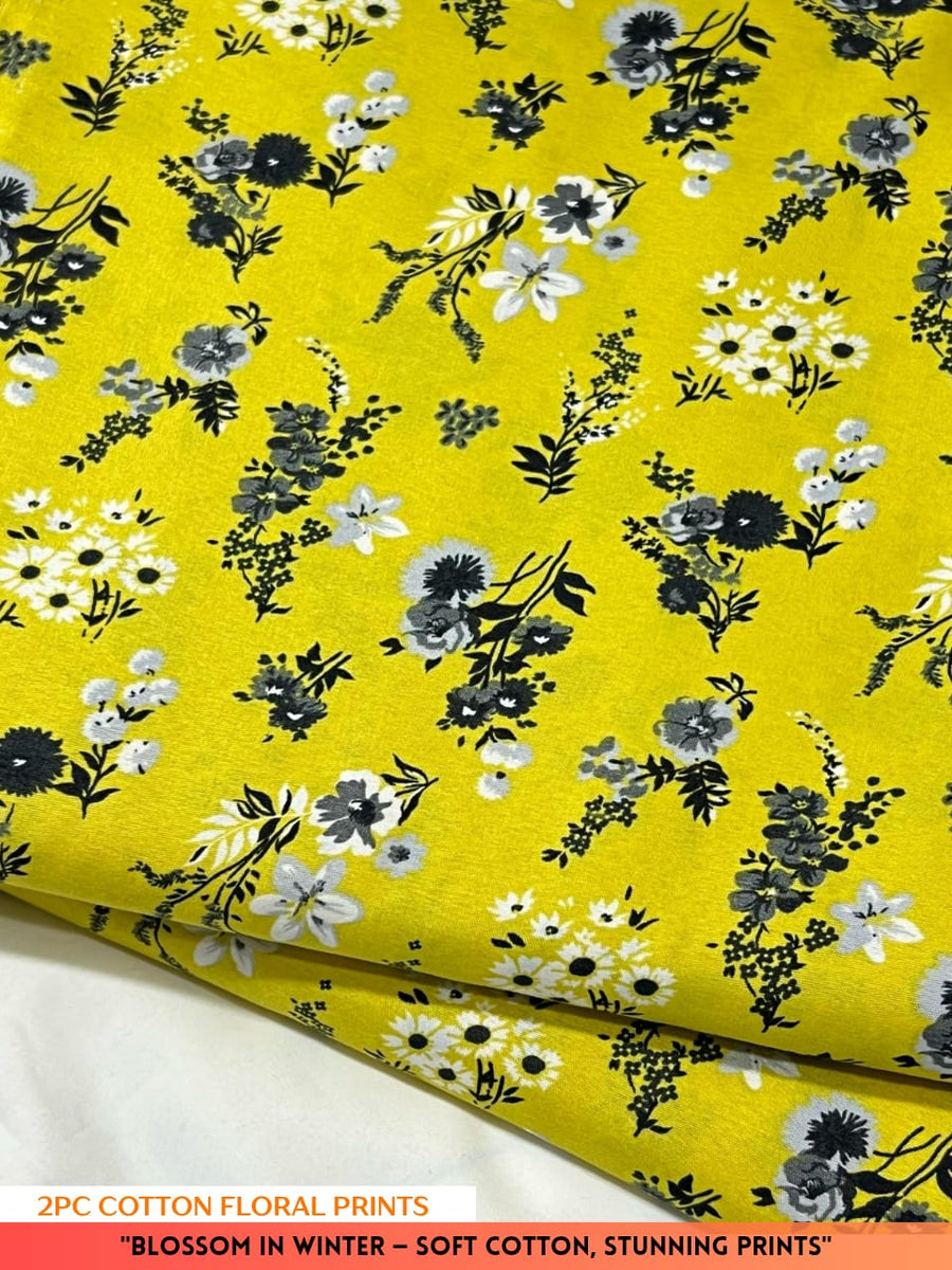 Floral fabric with yellow background and black and white flowers